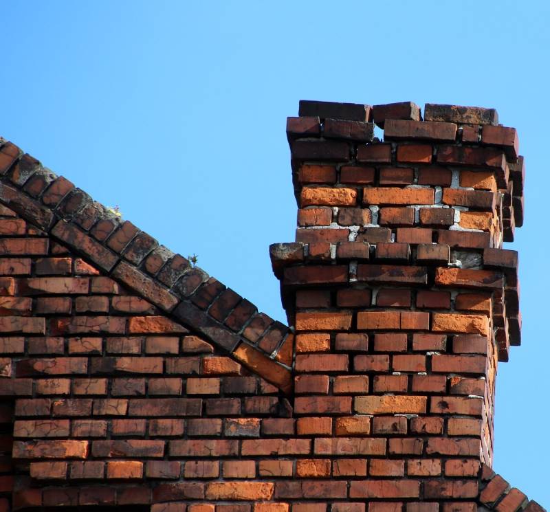Signs Your Dexter Home Needs a Chimney Inspection Damaged chimney on an Dexter home showing cracks and missing mortar